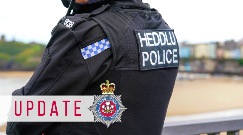 The word update overlayed on a picture of an officer
