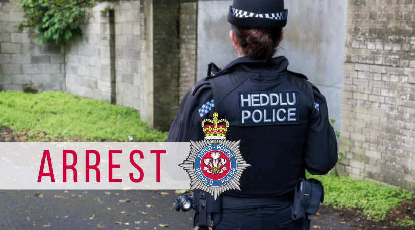 A PC pictured from behind, with the word arrest on a white background
