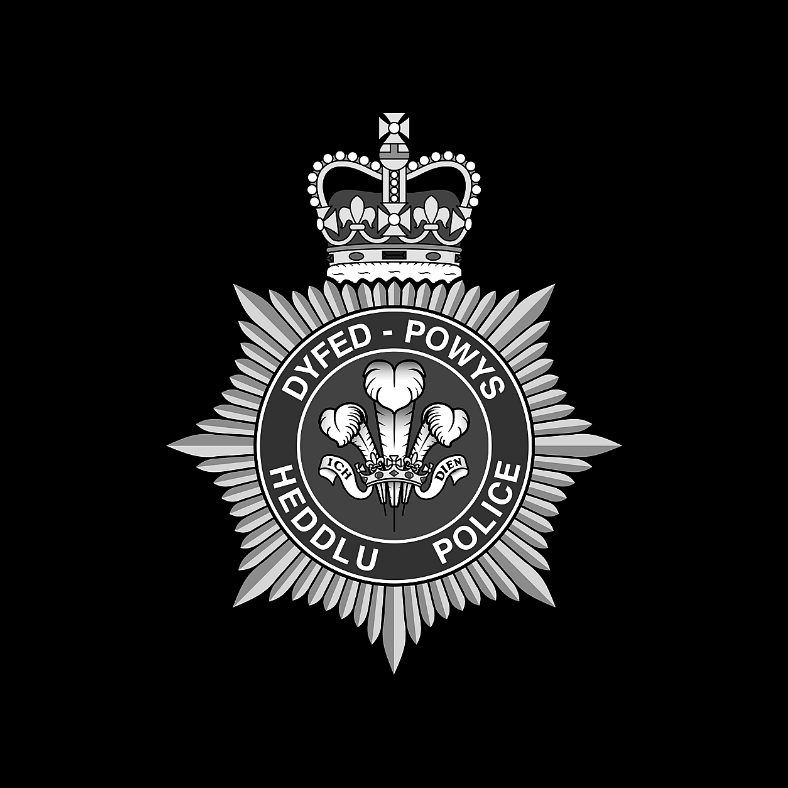 The Dyfed-Powys Police crest on a black background