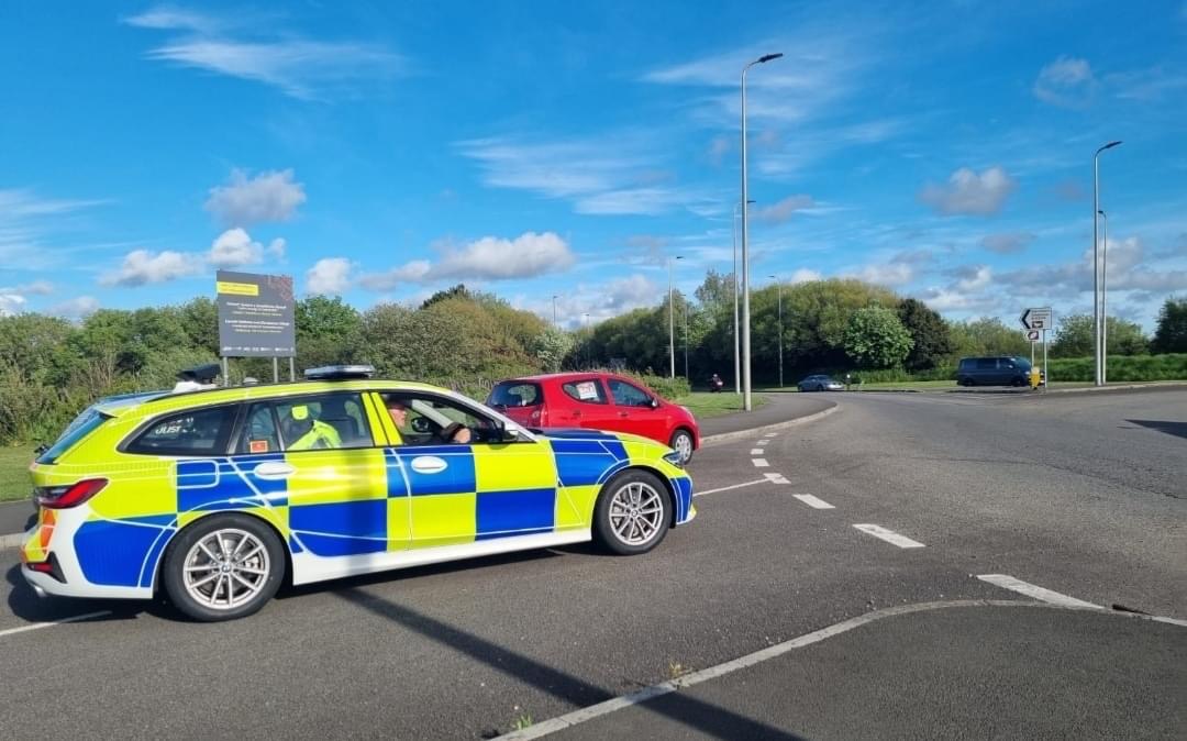 A police car on the coastal road in Llanelli