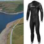 A photo of Claerwen Reservoir from the air, with an inset photo of a black wetsuit