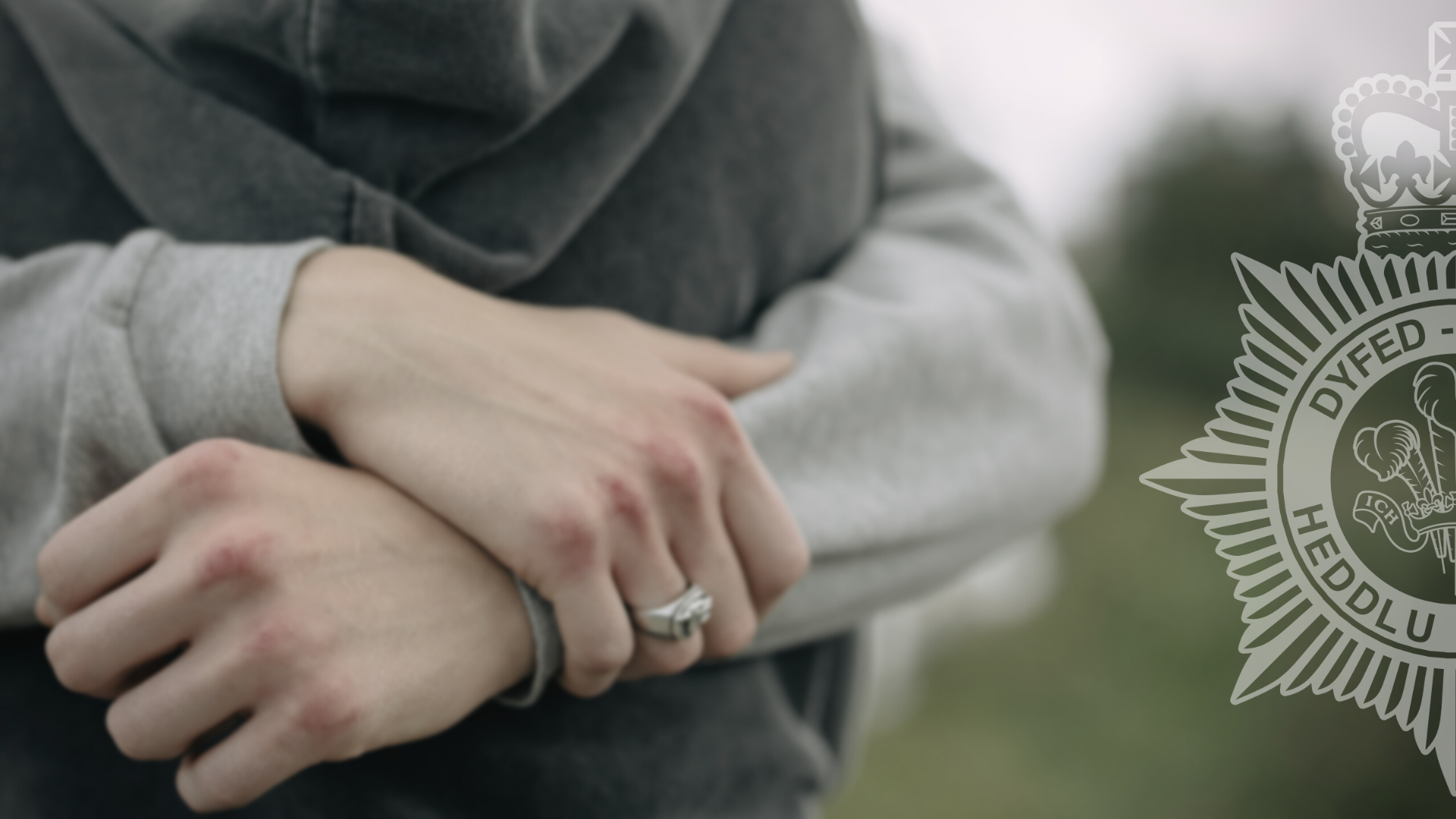 Stock image of a couple's arms in an embrace