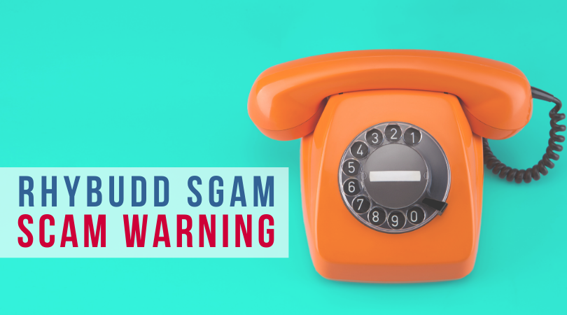 Telephone with wording rhybudd scam - scam warning