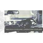 Op Coupland logo - sepia image of a police officer driving a car