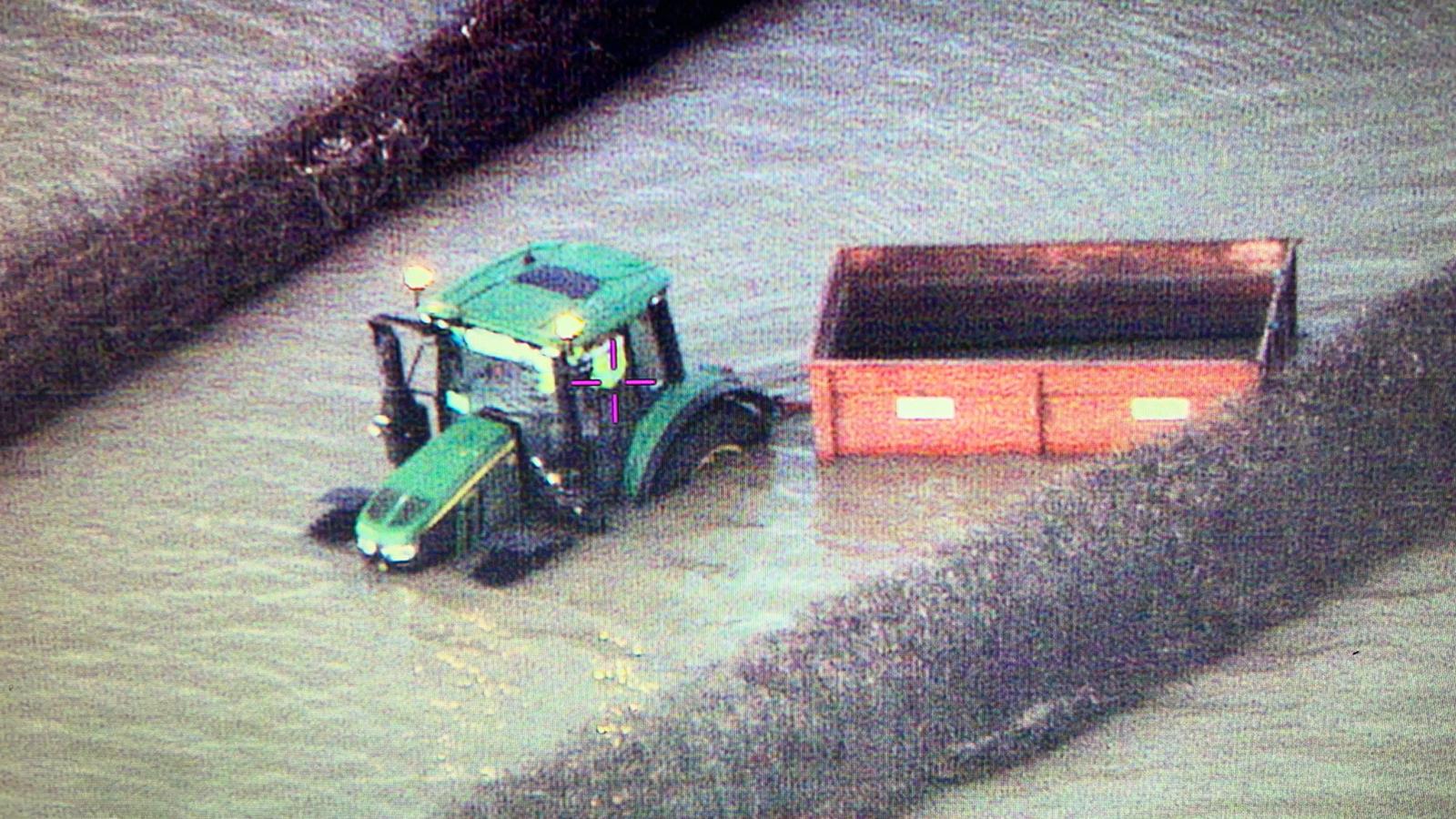 The tractor in the floodwater
