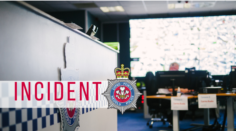 Stock image of Dyfed-Powys Police control room with the word incident overlaid on a white banner