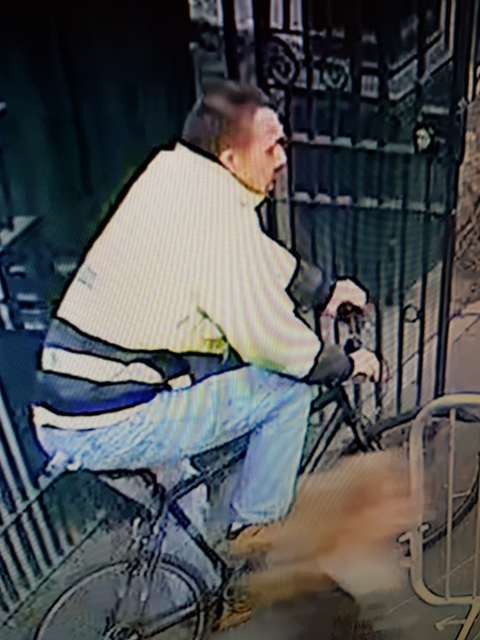 CCTV sill of man on a pushbike, who police would like to identify